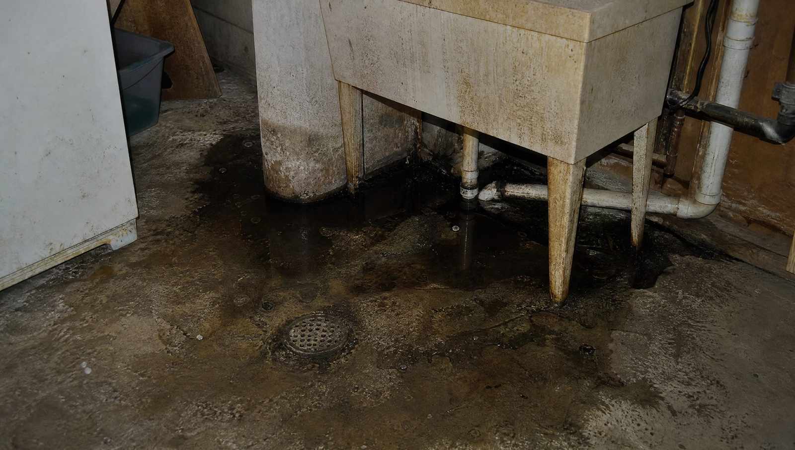 Slow draining utility sink and floor drain in a Colorado home served by a septic tank